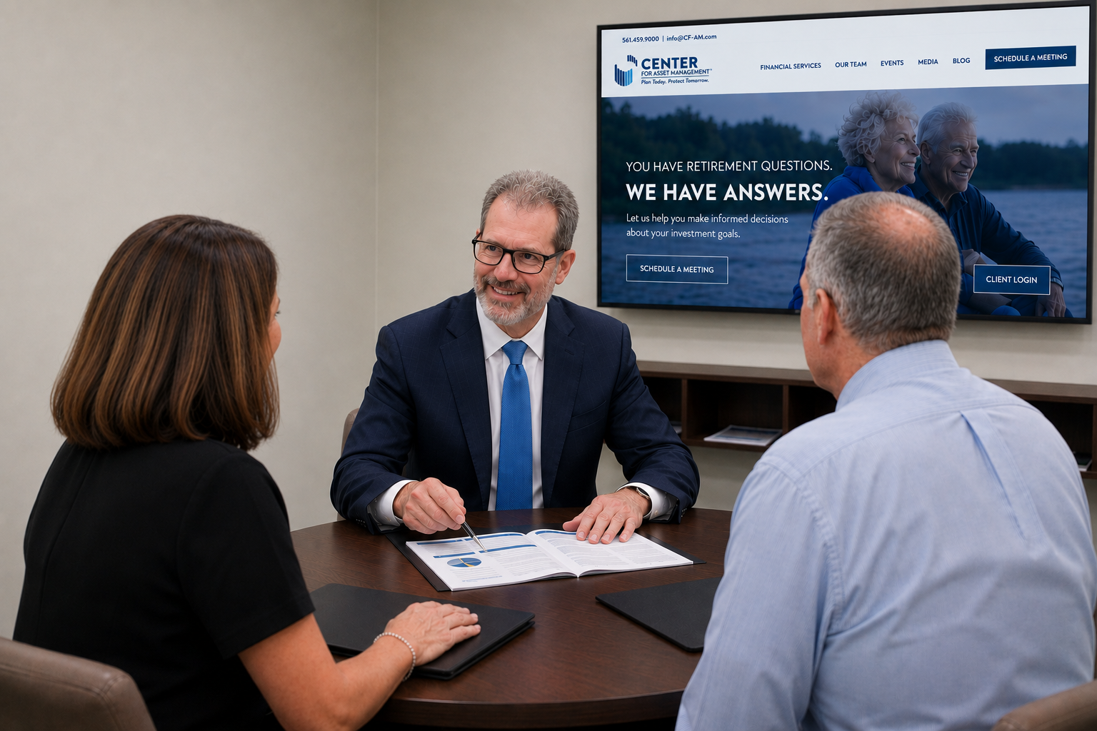 Peter Blatt meeting with clients in the Center for Asset Management conference room to discuss retirement planning, investment strategies, and financial planning.